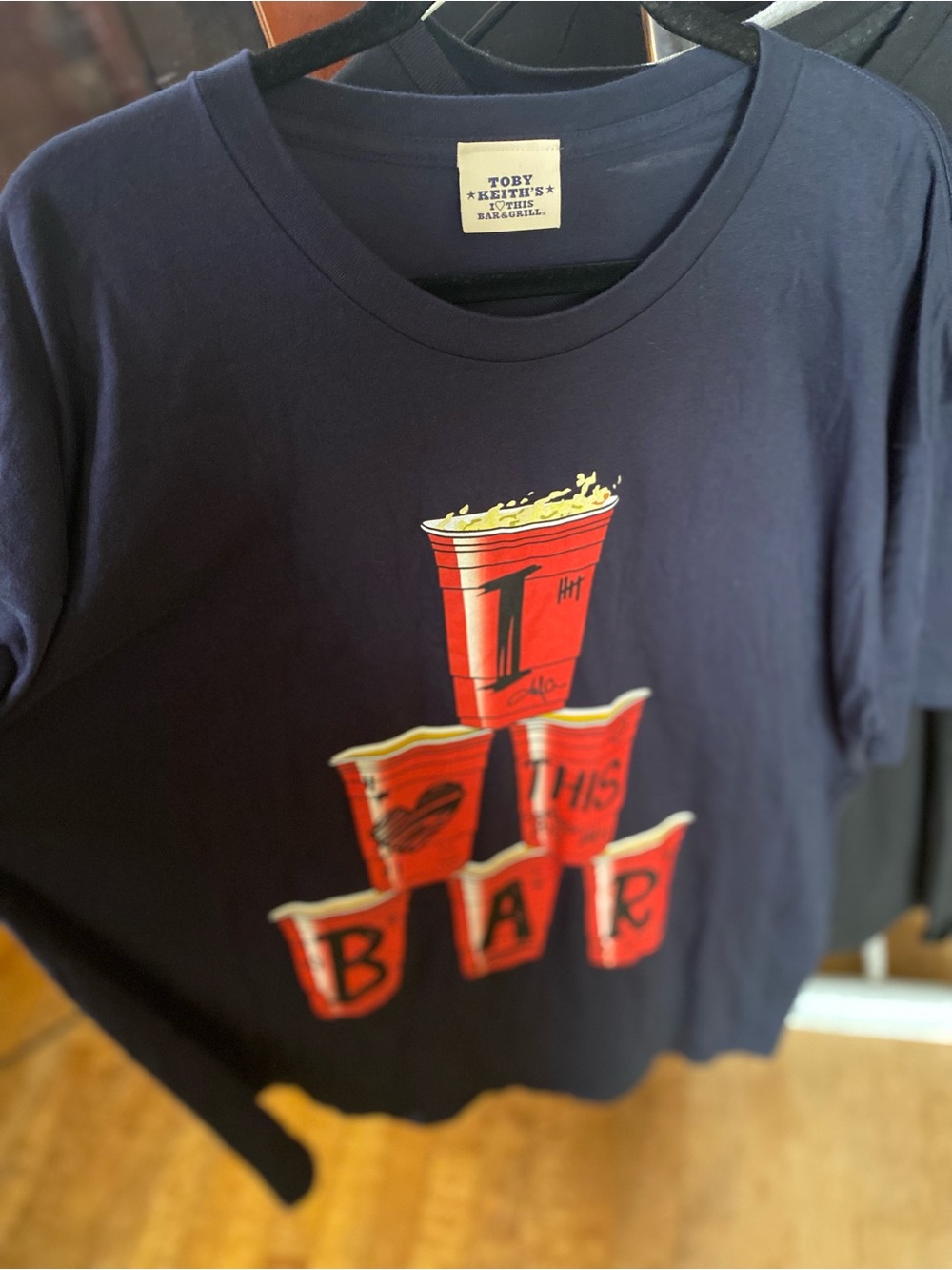 Toby Keith - I love this bar - Navy Short-Sleeve Graphic Tee with Red Cup Stack
